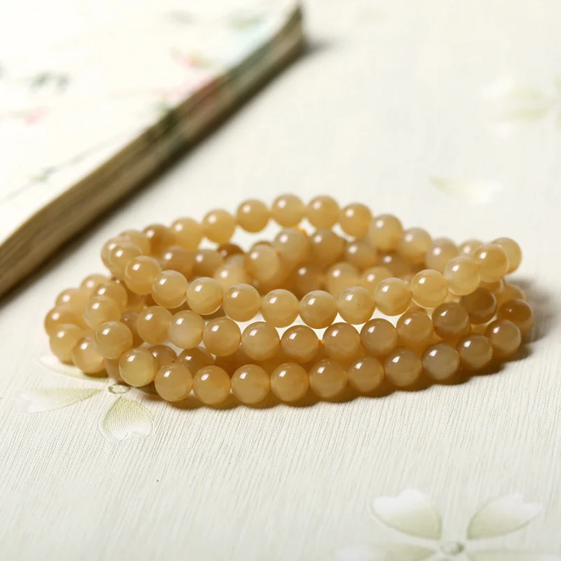 

Hetian jade 108 beads necklace and multi-strand sugar gold bracelet