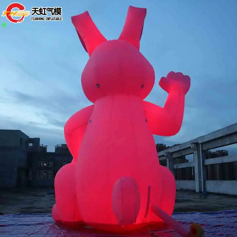 กระต่ายเป่าลมอวยพรเทศกาลอีสเตอร์ถือไข่สำหรับโฆษณา โมเดลกระต่ายเป่าลมขนาดใหญ่สำหรับตกแต่งสนาม