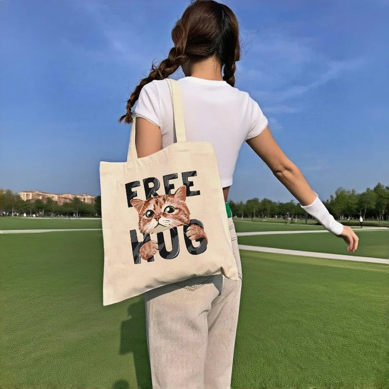 

1pc Double Sided Free Hug Cute Tabby Cat Canvas Tote Bag Funny Pet Letter Print Casual Reusable Shoulder Shopping Handbag