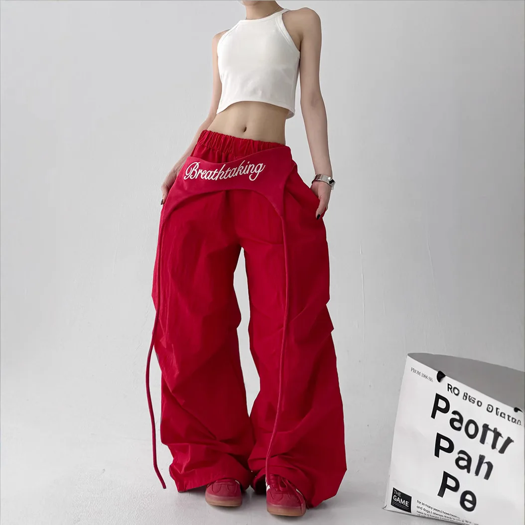 Pantaloni bootcut da donna - Pantaloni larghi streetwear con drappeggio sui fianchi e lacci in vita, pantaloni casual con orlo curvo hip-hop americano bianchi