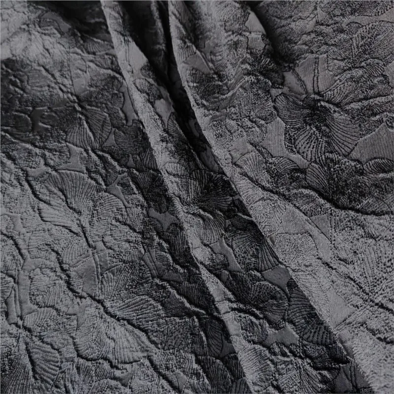 This is a women's dress fabric with and soft dark jacquard lines three-dimensional drape