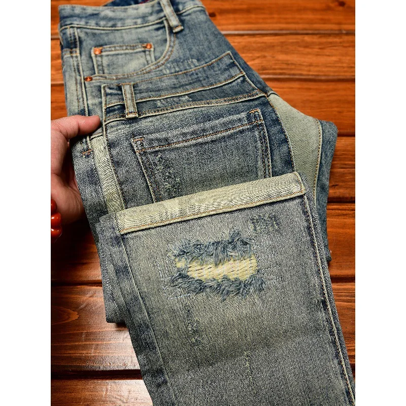 กางเกงยีนส์สไตล์สตรีทสุดเท่ห์สำหรับผู้ชาย ดีไซน์แบบเรโทร แต่งลายปะติดและขาดๆ ทรงเข้ารูป สไตล์อเมริกันสุดเทรนดี้ กางเกงขายาว