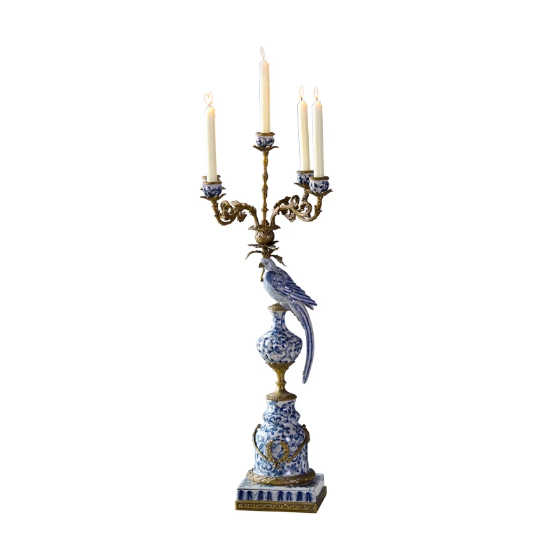 A beautiful parrot home decor candlestick made of porcelain and bronze, inspired by vintage design ceramic candlesticks