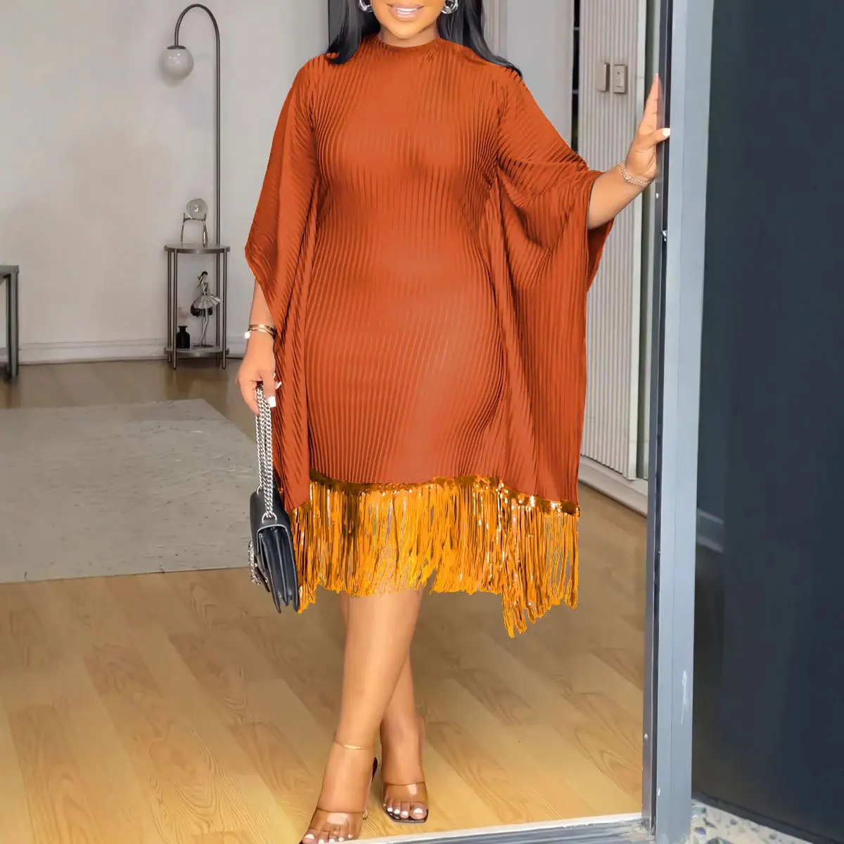 

The 2025 summer new sequined tassel bat-sleeve elastic hip-hugging dress