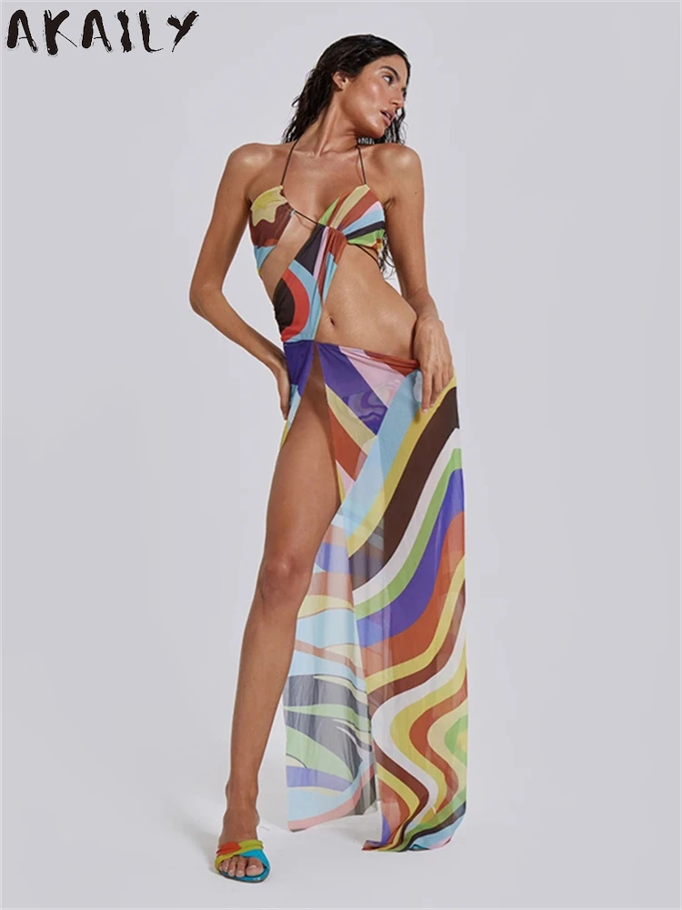 Akaily-Vestido largo ahuecado con estampado colorido para mujer, traje de playa de vacaciones, Irregular, Sexy, transparente, con cuello Halter, 2024