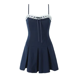 YENKYE White Lace Patchwork Navy Blue Sling Mini Dress For Women Sexy Low Waist Pleated Hem A-line Party Dresses Summer Robe