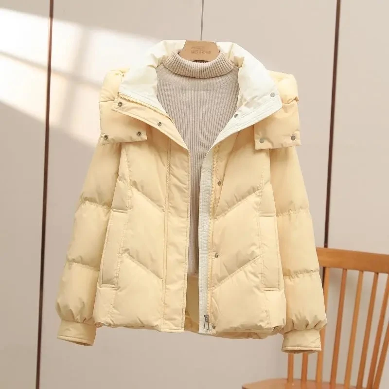 Chaqueta de algodón bloqueada de Color para mujer, nueva versión coreana, abrigo de invierno grueso y holgado, Parka cálida con capucha para mujer 2025