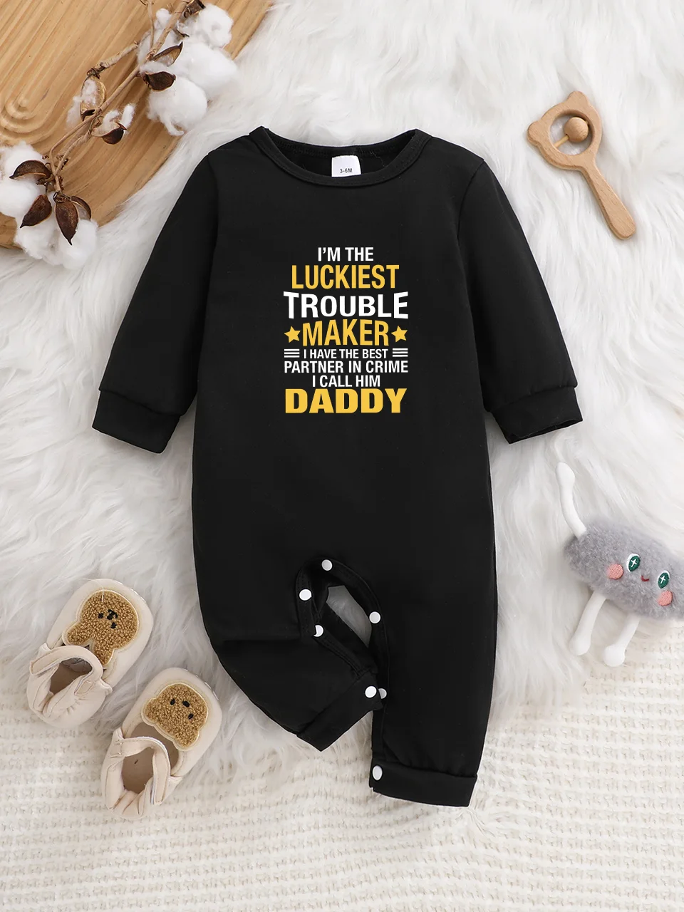 

Baby long-sleeved bodysuit with fun letter prints, button design, easy care, suitable for new parents.