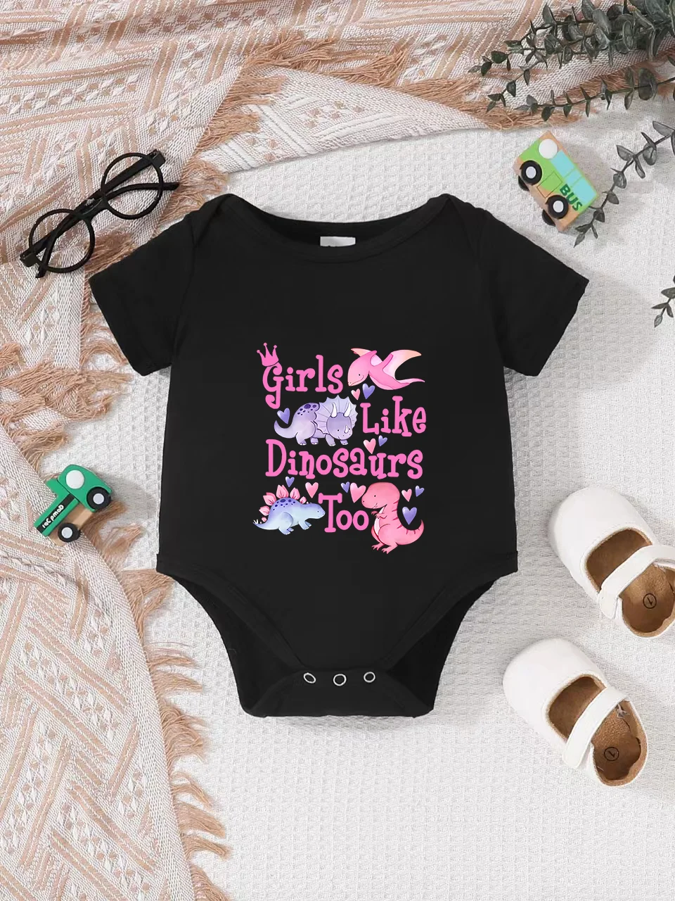 Playful letter-printed baby short-sleeve triangle bodysuit. Button closure for easy dressing