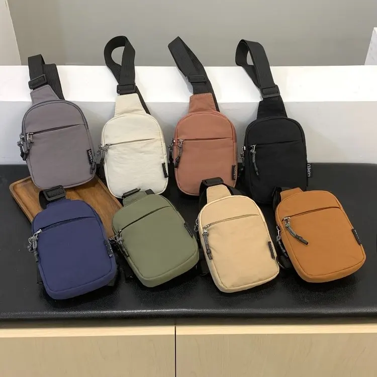 bolsa-masculina-de-nylon-tamanho-universal-bege-laranja-caramelo-azul-transversal-de-ombro-Unico-para-nova-chegada-outono-2026