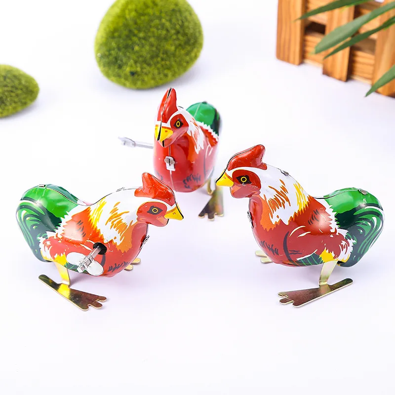 This is a classic spring jumping iron rooster children's toy, action doll children's toy, and children's classic spring toy gift
