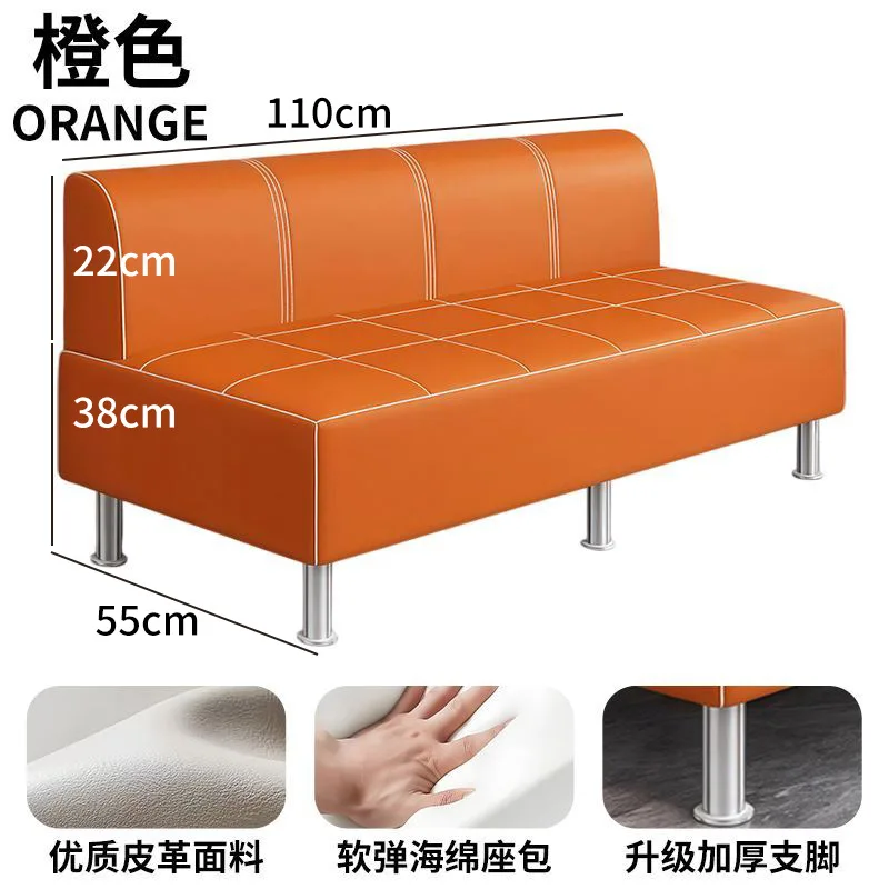 Long simple sofa, sofa stool in the sitting area of the clothing store