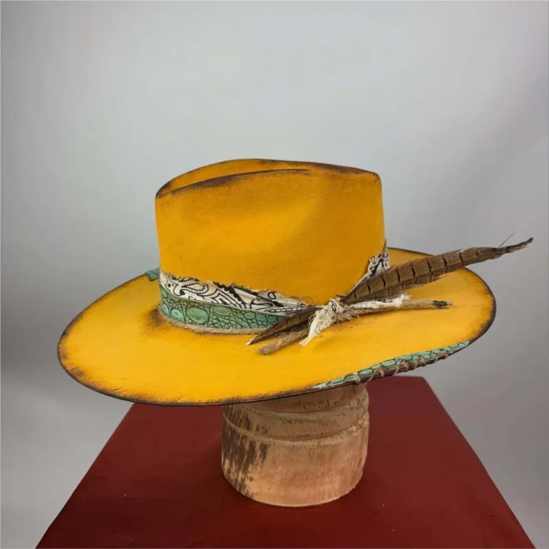 A yellow floral fabric decorative band and felt hat