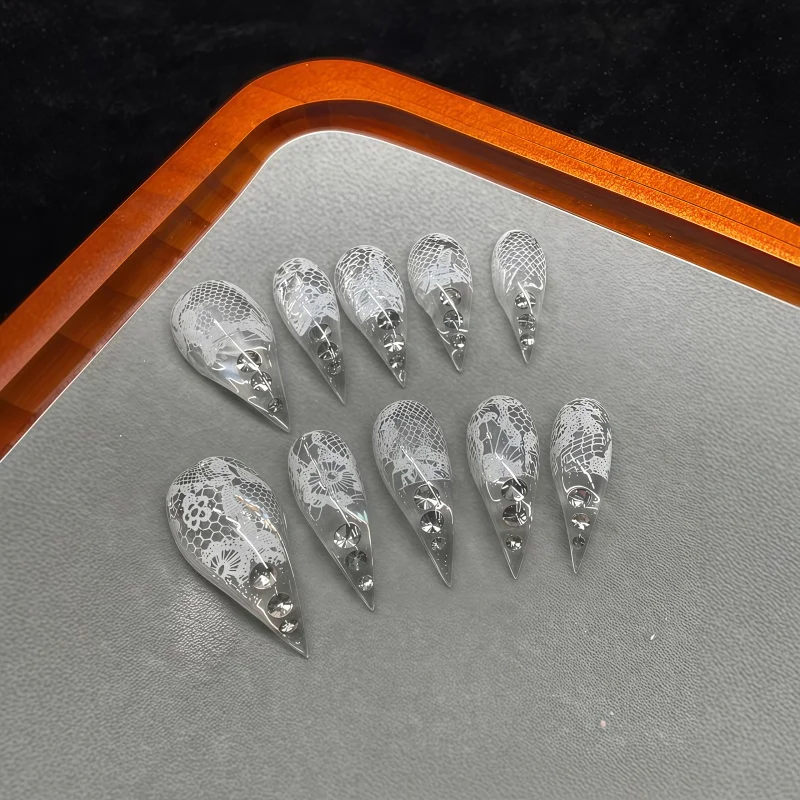 10PCS of ultra-long transparent glitter nail stickers featuring white lace floral pattern with glossy and transparent appearance