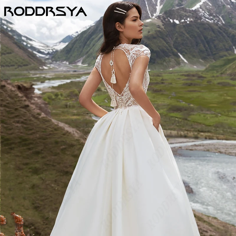 RODDRSYA Sexy scollo a v pizzo a-line abito da sposa Boho Cap Sleeve tasca inseribile festa nuziale morbido raso Backless Robe De Soirée Sexy scollo a v pizzo a-line abito da sposa Boho Cap Sleeve tasca inseribile fest