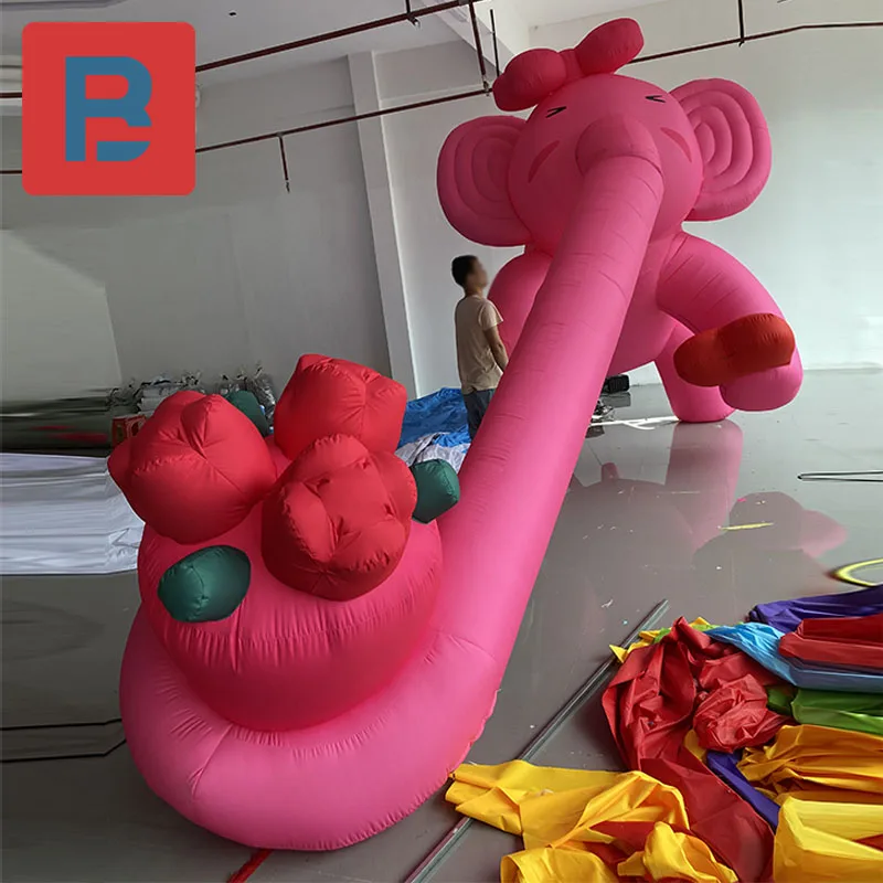 Inflatable elephant air model romantic pink take flowers long trunk elephant climb wall roof external facade lighting decoration