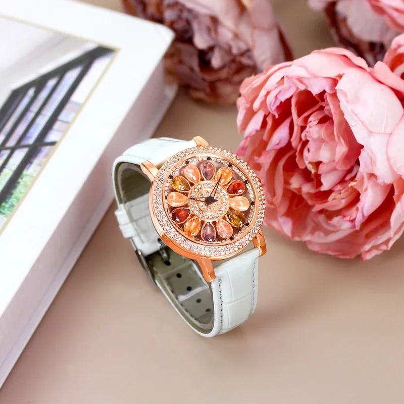 A women's white leather belt fashion stylish rainbow candy rotating dial quartz watch