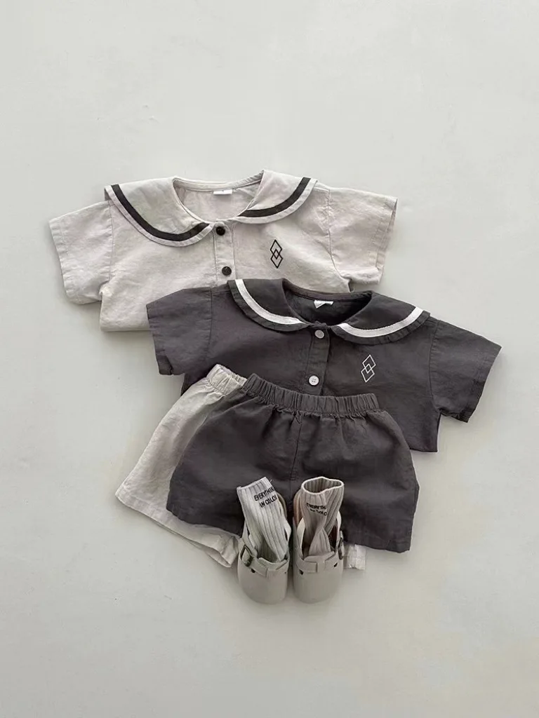 Conjunto de ropa de manga corta para bebé, pantalones cortos informales para niño y niña, traje de cuello azul marino con patrones geométricos,