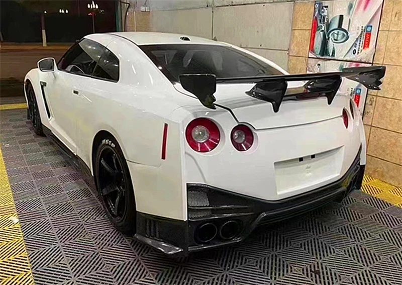 

Для Nissan GTR R35 2009-2022 настоящее углеродное волокно задний багажник крыло верхний спойлер обвес комплект