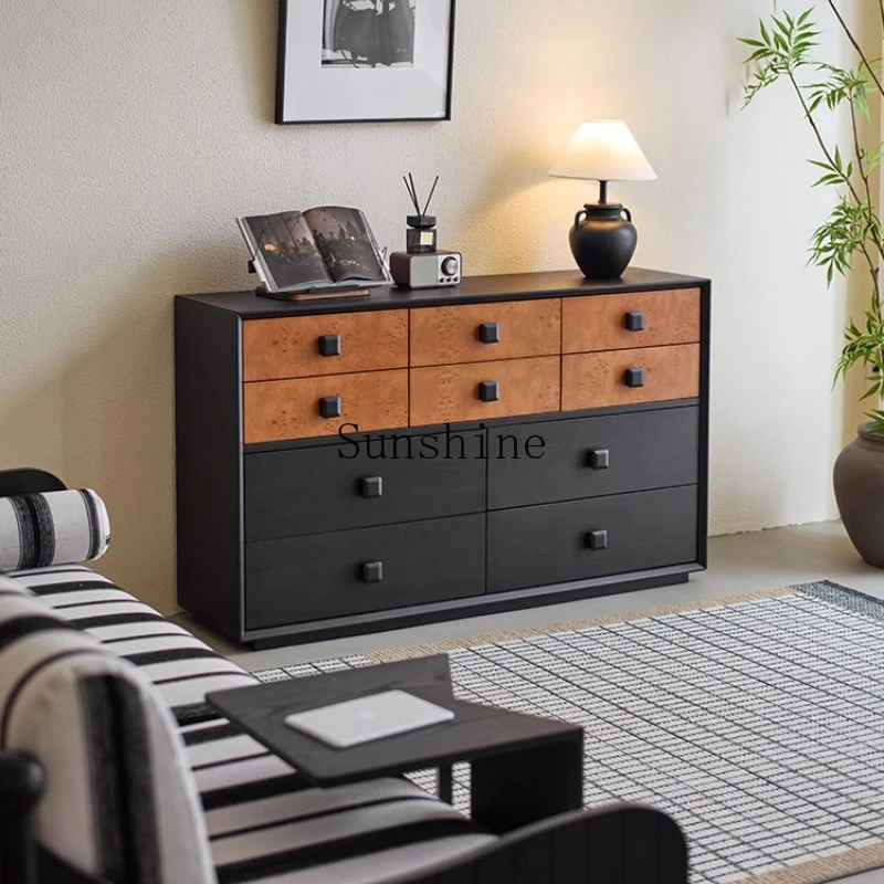 

black next to sofa against wall in the living room, storage at the end bed in the bedroom, storage cabinet.