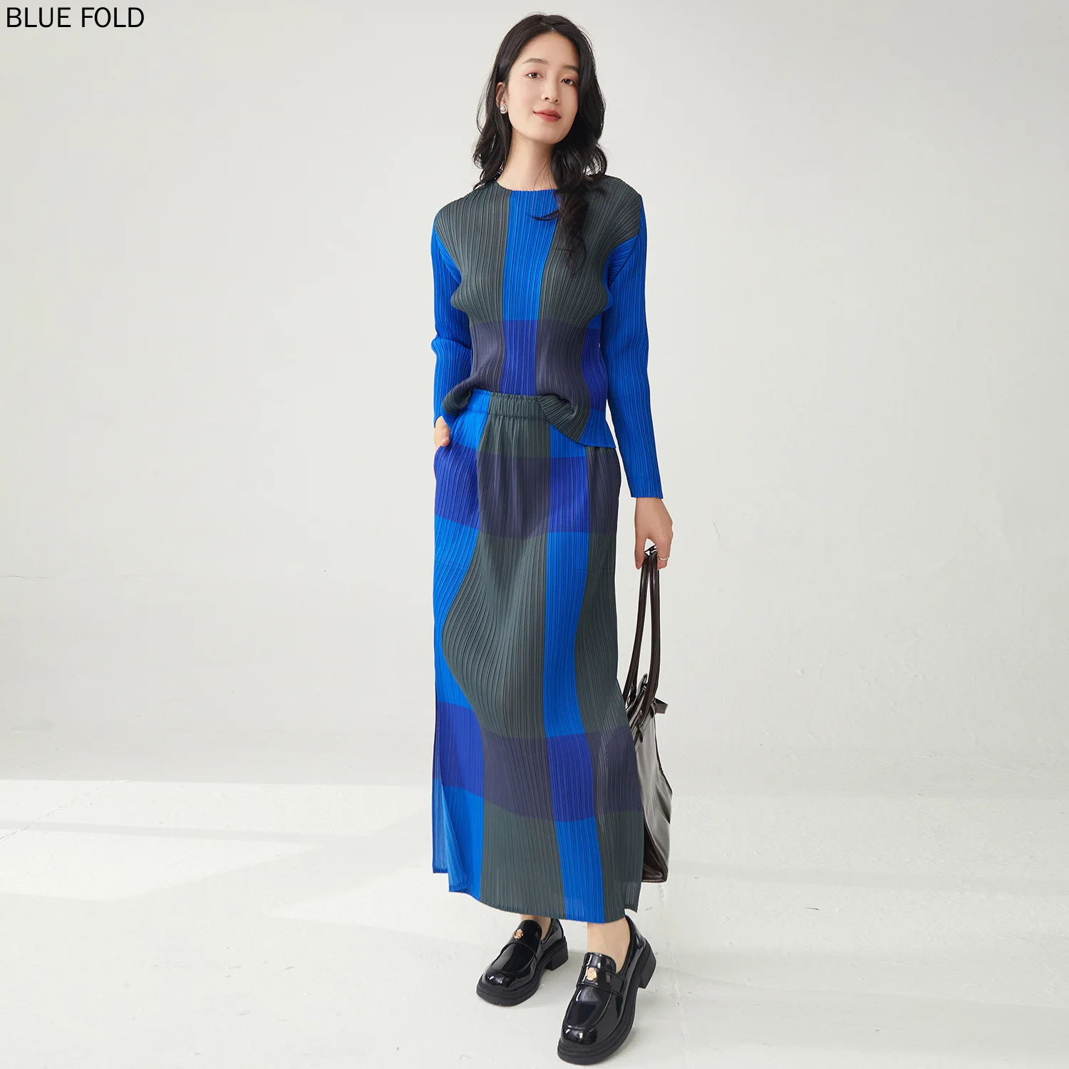 Primavera 2025 temperamento Casual Xadrez camisa de manga longa das mulheres e saia de divisão conjunto de duas peças Miyake estilo saia define