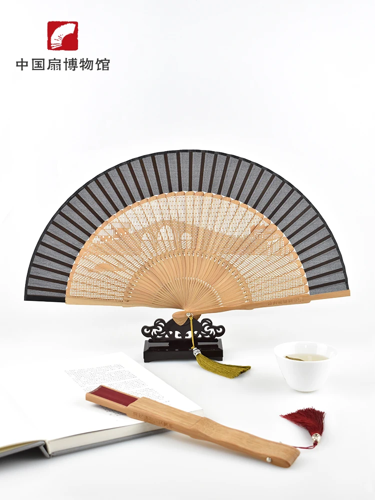 Chinese wind fan-bamboo bone silk hollow folding fan gift tassel wenchuang fan