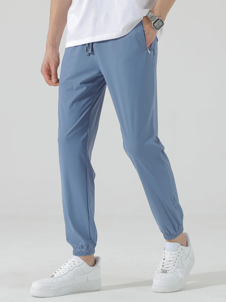 Pantalones de chándal finos de seda de hielo para hombre, pantalón de chándal informal de nailon elástico de secado rápido, novedad de verano, 2024