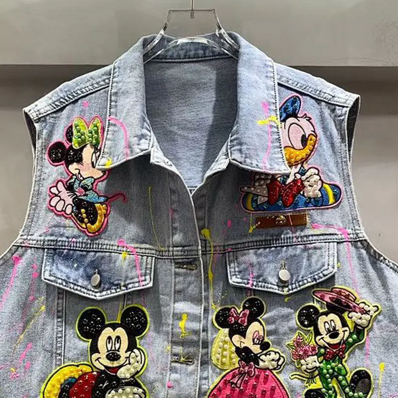 Kamizelka w stylu commuter z koralikami, cekinami i graffiti, kurtka dżinsowa o średniej długości w stylu heavy industry, wiosna-jesień 2026, kamizelka Y2k z motywem kreskówkowym.