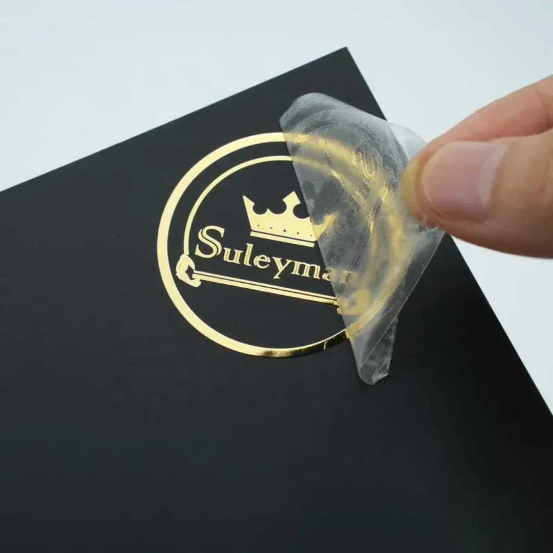 Custom Die-Cut Stickers, Metal Logo Stickers, UV Transfer, Hot Stamping, or Metallic Finish Labels for Packaging Branding.