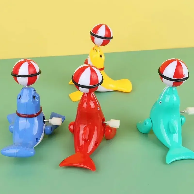 New 1Pcs Winding Will Run 360 Degree Rotation Novelty Fun Cute Wind-up Clockwork Sea Lion Top Ball Children's Educational Toys