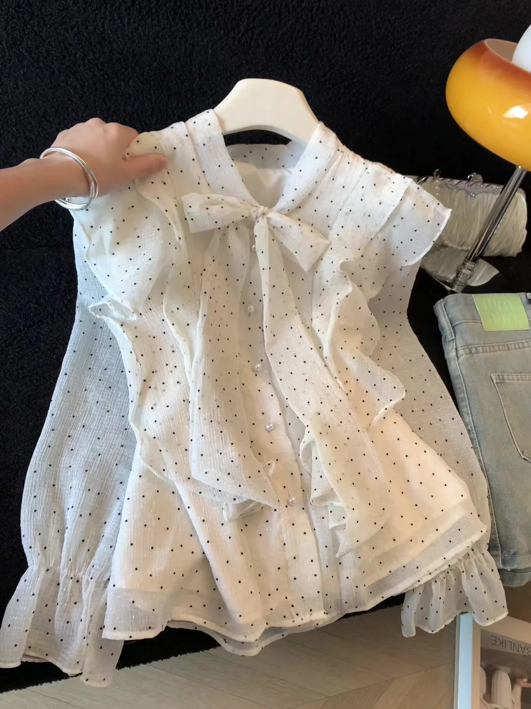 

Fashionable and sweet bow polka dot shirt for women in spring 2026, new high-end style, unique and beautiful ruffle edge top