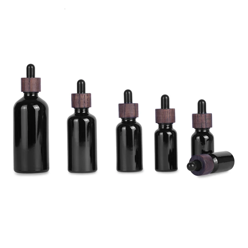 

Wholesale Luxury 5/10/15/20/30/50/100ml Black Essential Oil Serum Glass Dropper Bottles with Dark Bamboo Lids Cosmetic Packaging