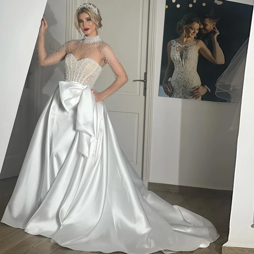 

Customized Pearls Satin Wedding Dress 2026 High Collar Mesh Sleeve Bridal Gown with Bow Tie Court Train vestidos de novia