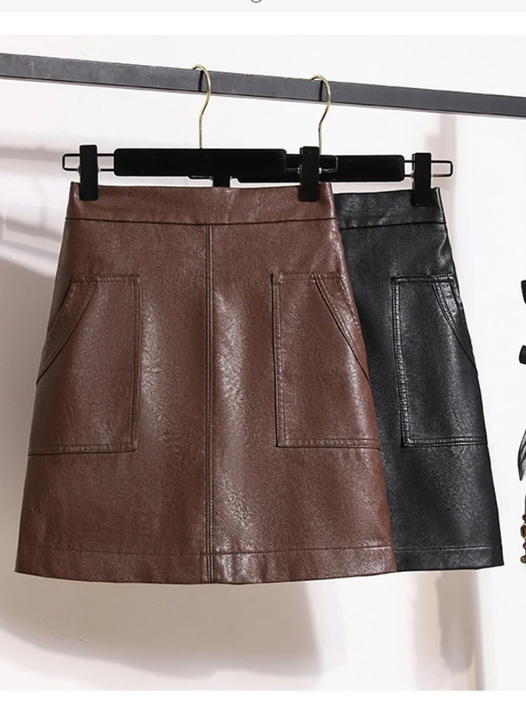 

Женская осенне-зимняя новая короткая юбка из искусственной кожи с высокой талией, универсальная, стройнящая, модная, А-силуэта, облегающая бедра.