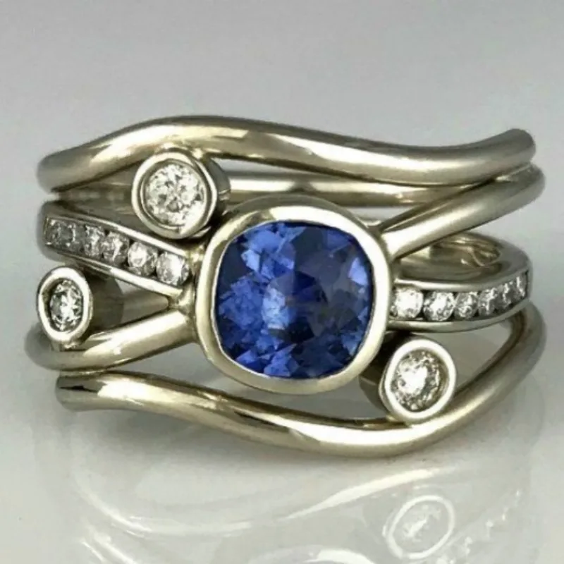 Minimalistischer, mehrschichtiger, gewickelter silberfarbener Ring mit eingelegtem blauem synthetischem Zirkon für Damen, stilvolles Ring-Accessoire für den täglichen Gebrauch