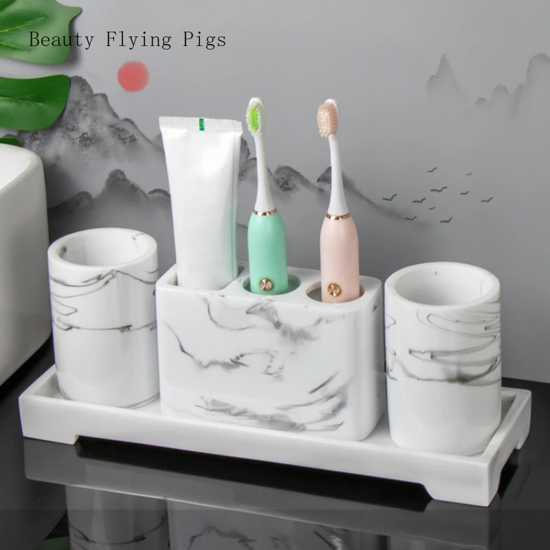 Creative and minimalist resin shelving for household restrooms, with a tabletop base and a mouthwash cup set of four pieces