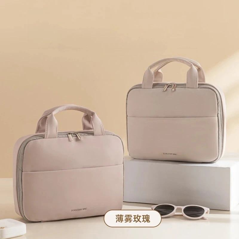 大容量の女性用化粧品バッグ - 防水の吊り下げ式メイクアップオーガナイザー、フックとハンドル付き、バスルームや旅行に最適