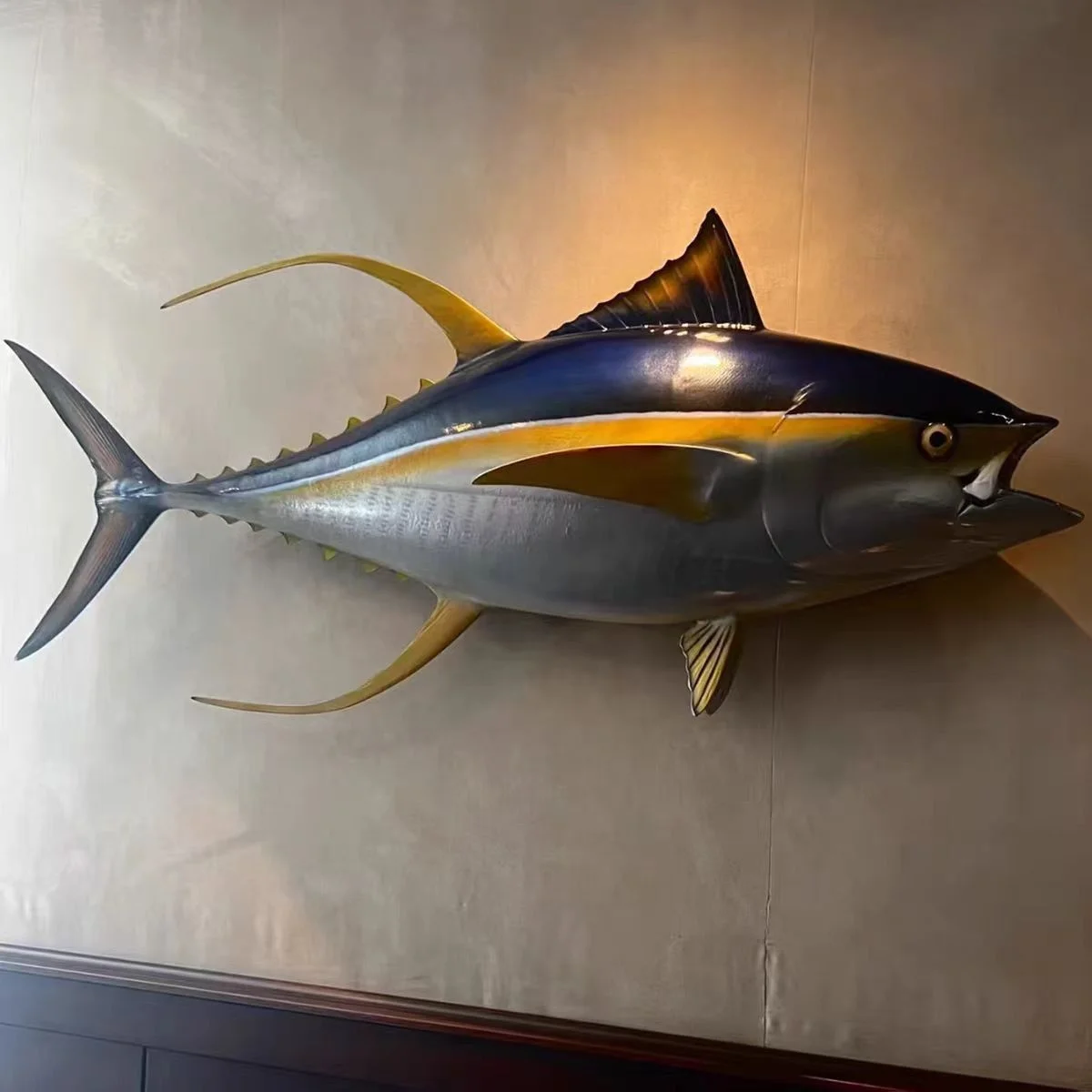 Tuna wall art full of painted fish sculptures Coastal restaurant décor