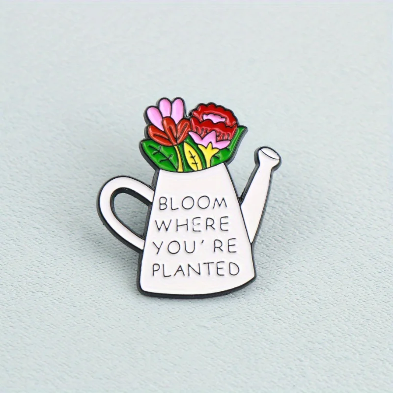 دبوس نمو ملهم — علبة سقي بيضاء مع زهور، "زهر أين أنت نباتي،" تحث النمو في مكان واحد. #2