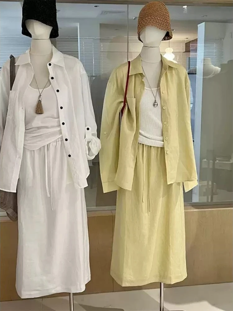 

Летний комплект из рубашки с отложным воротником и длинными рукавами для защиты от солнца + прямая юбка-полусолнце, женский повседневный однотонный комплект из двух предметов, подчеркивающий изящность.