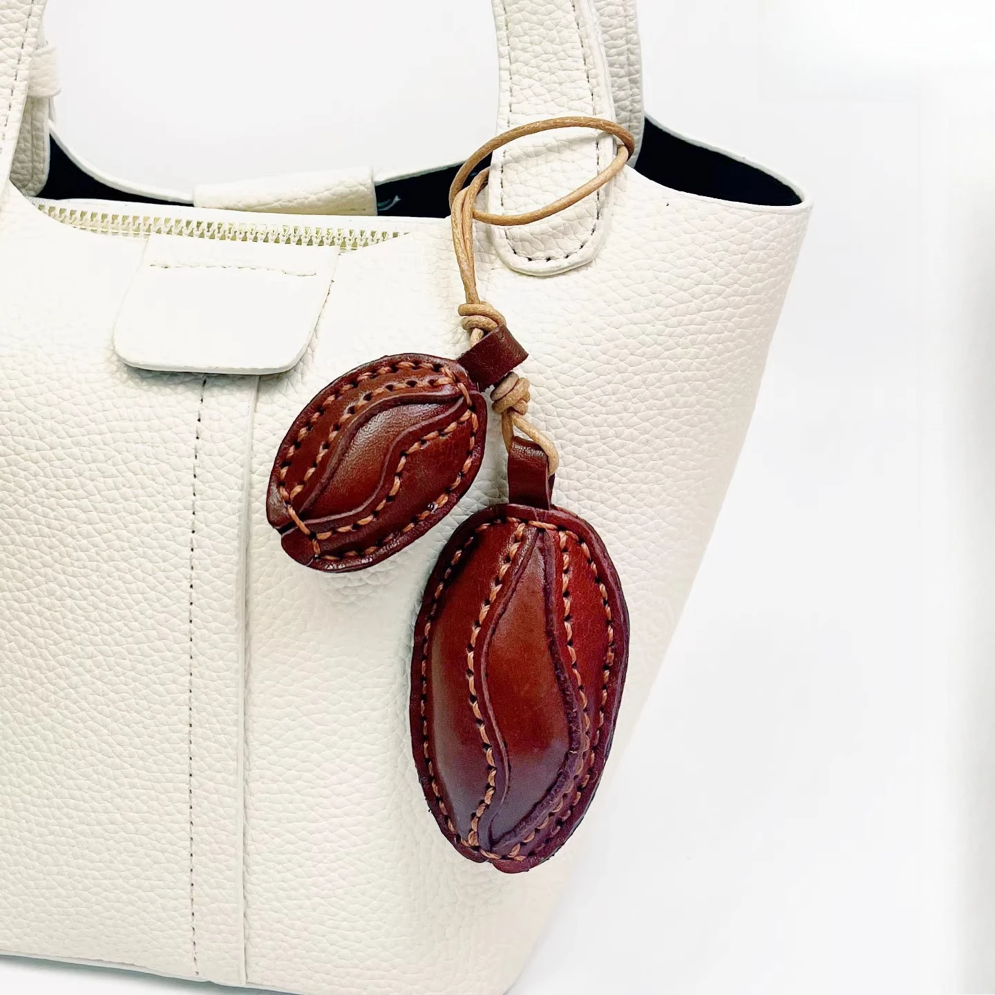 

A pair of handmade genuine leather coffee bean bag charms and keychains suitable for any bag simple and cute gift