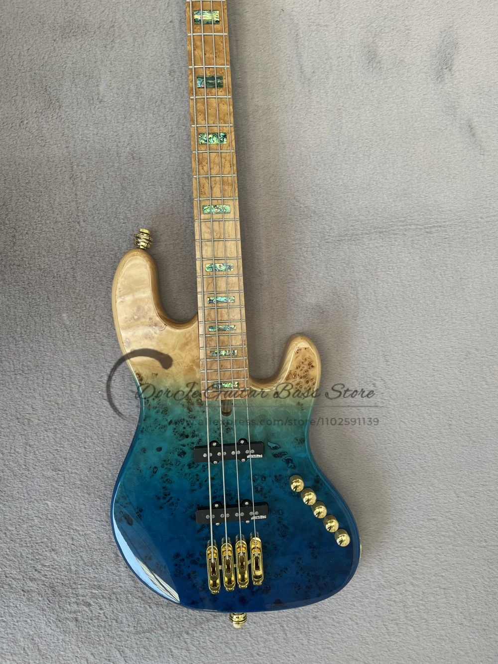 4 string gradient blue bass, fixed bridge, Burl maple top ash body, baked maple fingerboard, acrylic pickup board, active batter