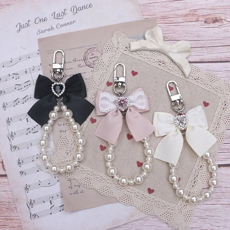 

Стильный брелок в стиле Харадзюку: бисерное сердце ручной работы с бантом, стразами и жемчугом для телефона или сумки-ита