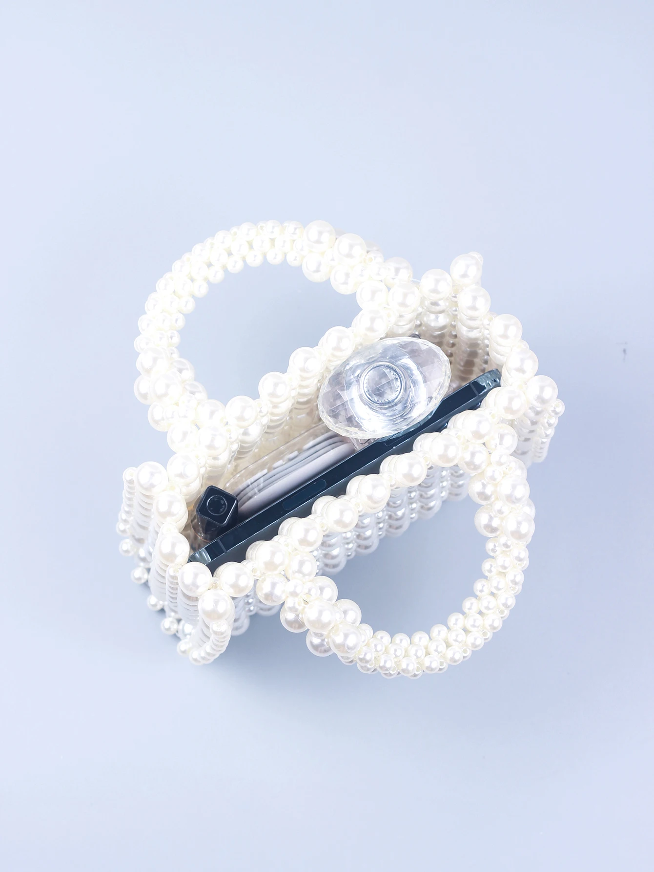 Small and high-end texture pearl hand-held woven pearl small square bag banquet bag, fashionable and versatile