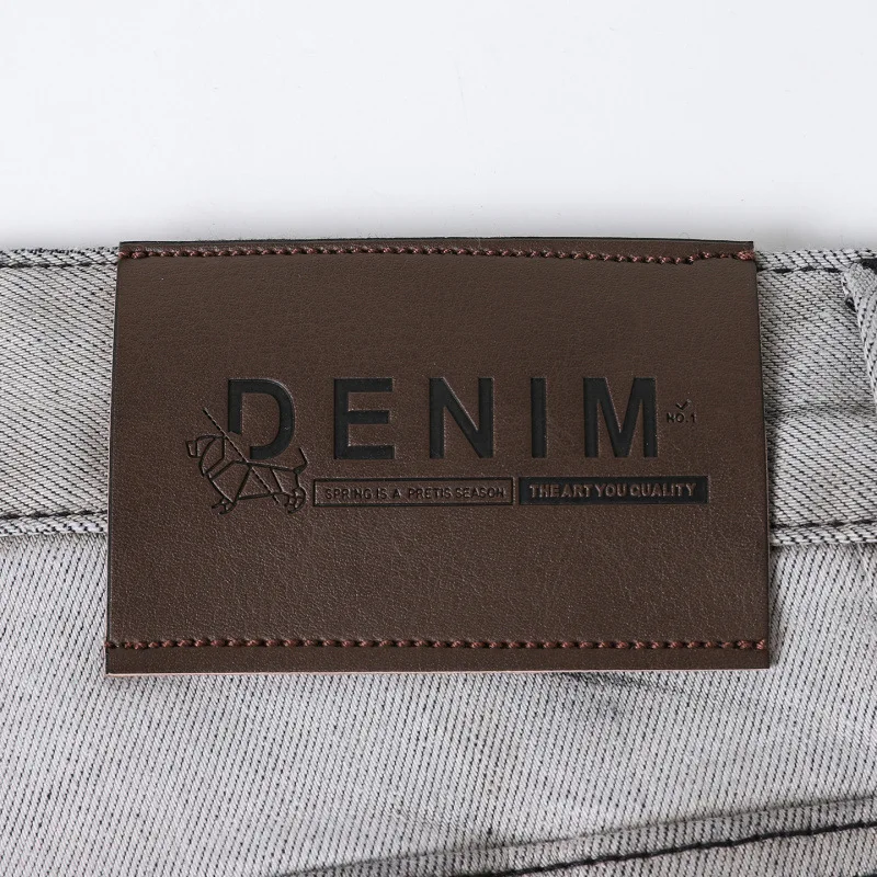 Jeans da uomo con stampa tie dye in bianco e nero con inchiostro 2025 pantaloni da uomo di fascia alta a tubo dritto piccolo autunno e inverno