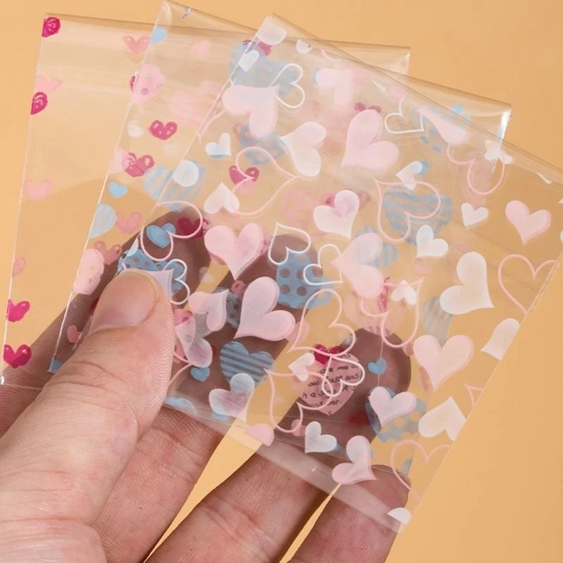 

100Pcs Elegant Gift Packaging and Display Bag Unique Valentine Cookie Packaging Bags with Seal for Handmade Treats