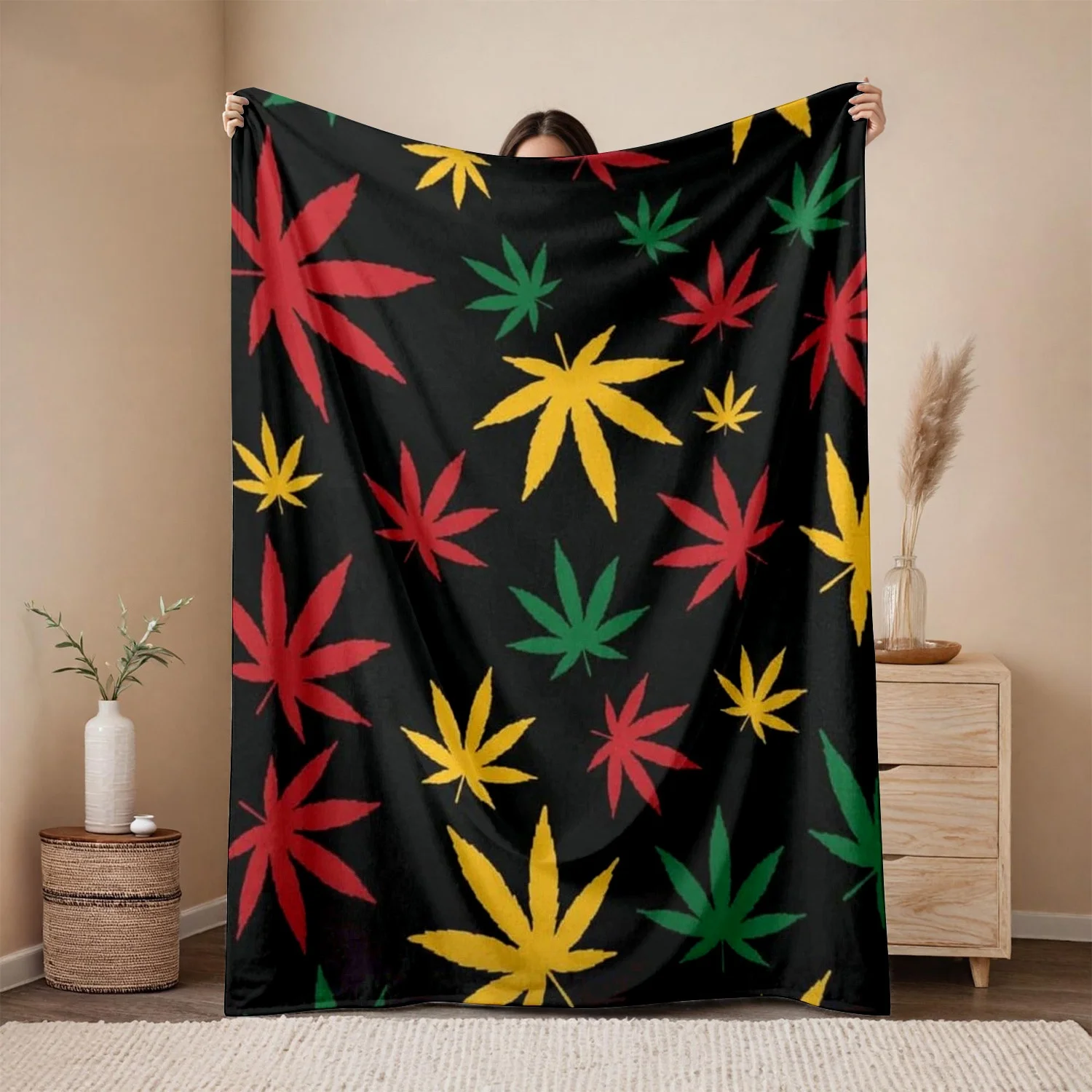 One Piece of  Flannel Blanket Featuring a Leaf Pattern - Ideal for Rasta-Themed Bedroom Decor, with a Bright Red And Green
