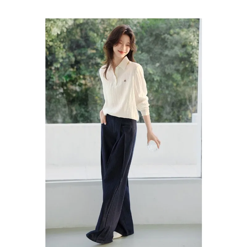 เสื้อเชิ้ตแขนยาวปักลายอเนกประสงค์ น้ำหนักเบา สไตล์ลำลองสำหรับผู้หญิง ฤดูใบไม้ผลิ 2025 รุ่นใหม่ คลาสสิก เรียบง่าย เหมาะสำหรับใส่ไปทำงาน