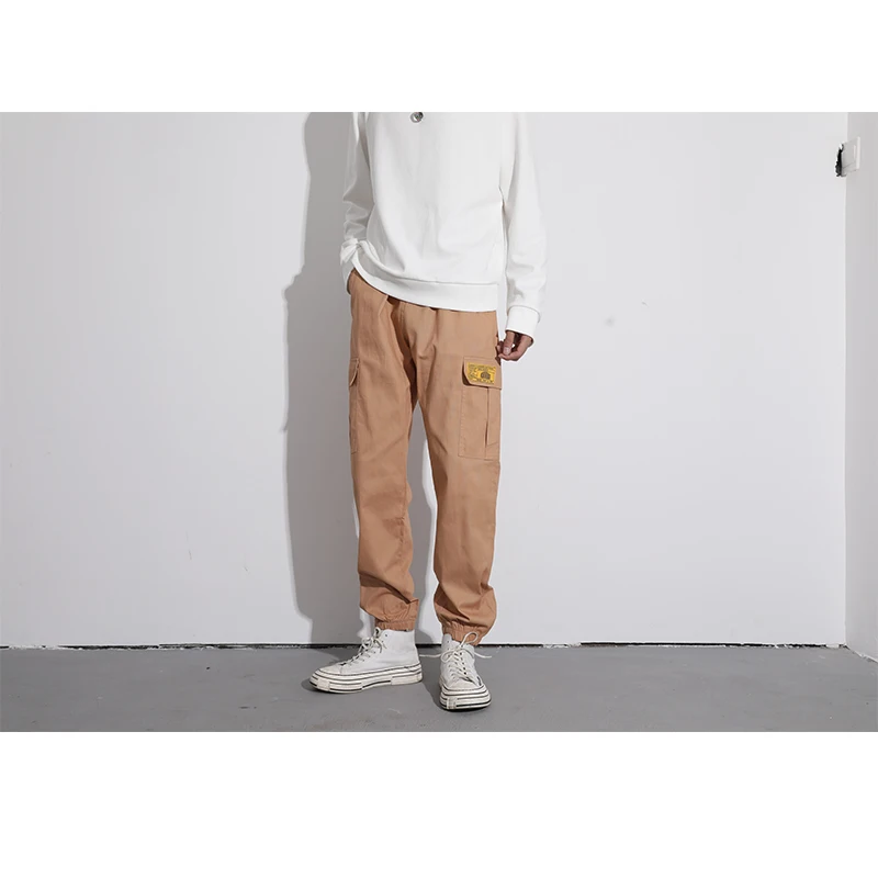 

Men's multi-pocket work pants, solid yellow with patch, casual pants for camping, hiking, and streetwear ...