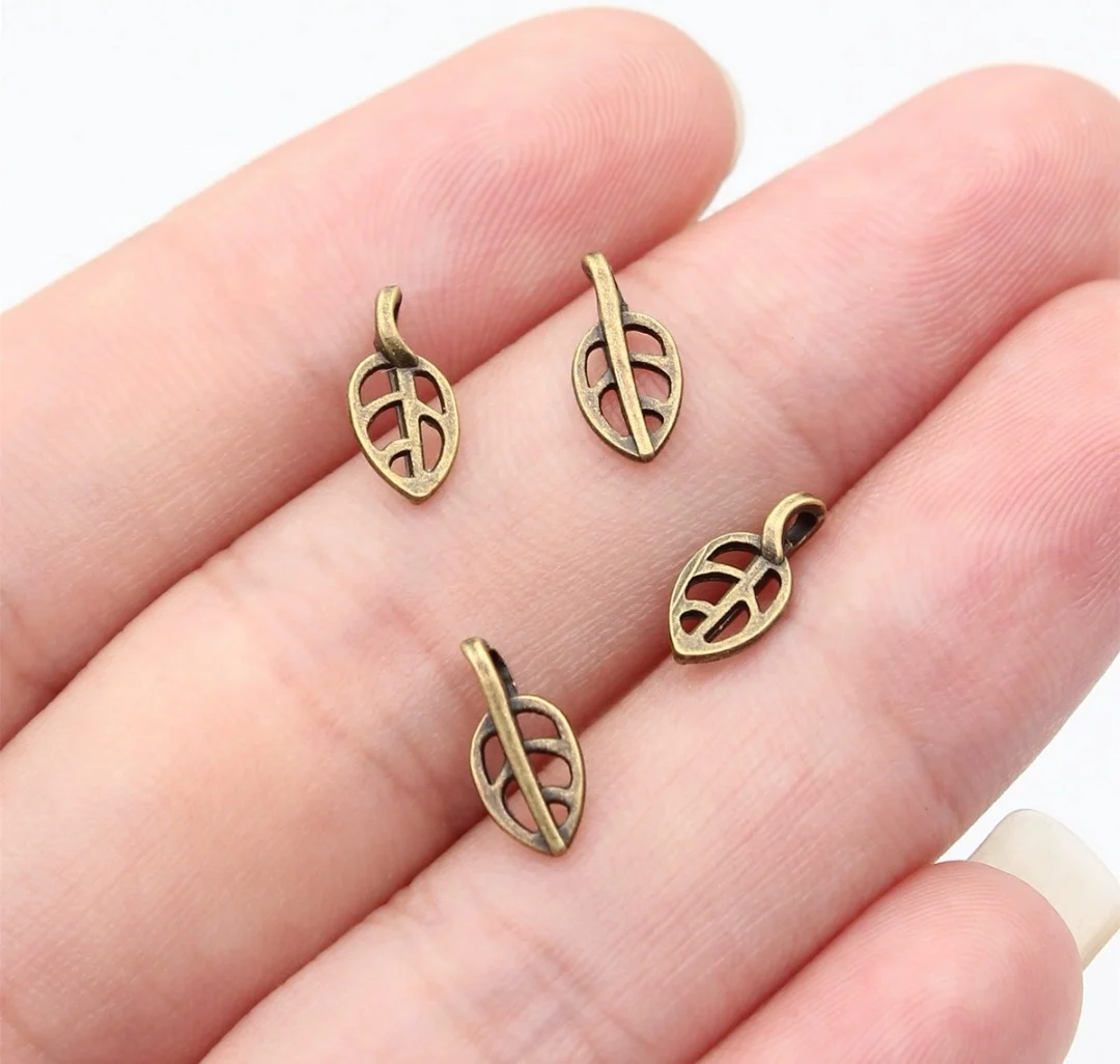 

200pcs 10x5mm Zinc alloy metal antiqued bronze plated charm T1147 for jewelry making